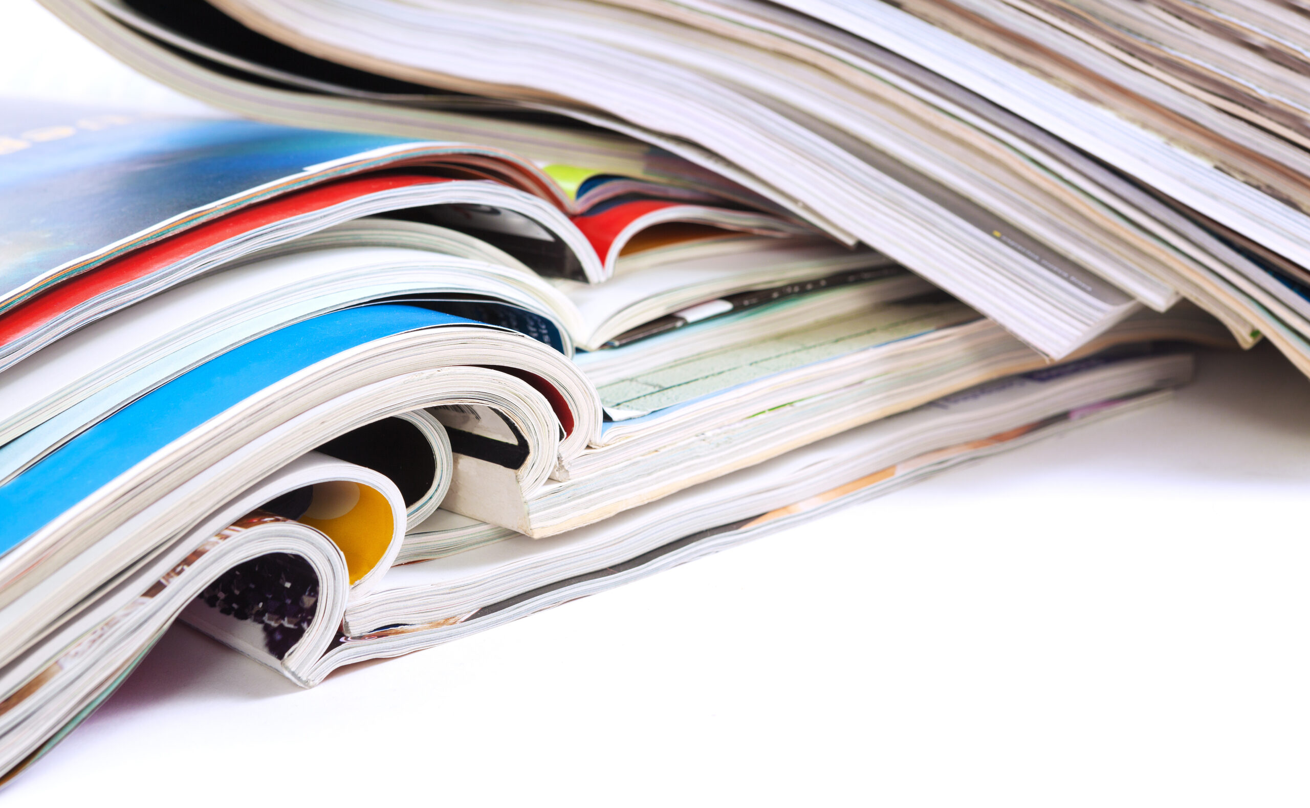 Close up image of magazines stack background. News and media publications